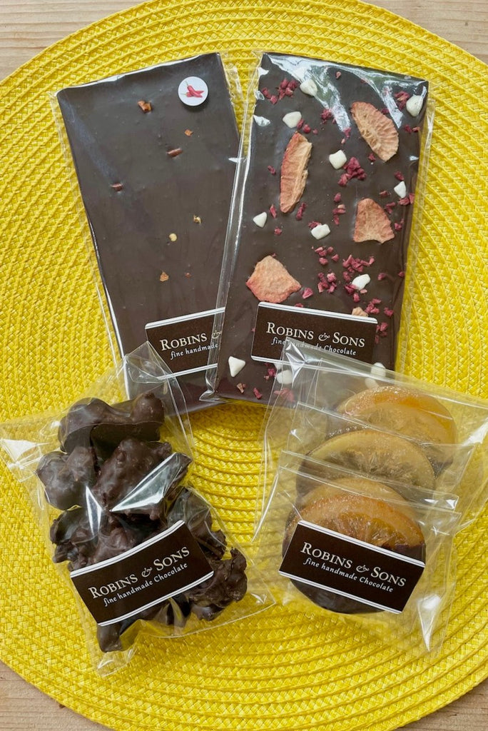 Dark chocolate lovers gift bag - containing dark chocolate chillie bar, very berry bar with strawberries and meringue, nut clusters and chocolate dipped orange slices