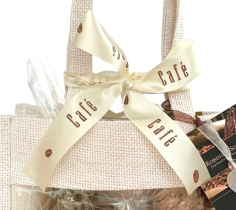 Coffee and chocolate gift bag. Cream coloured ribbon bow with words 'cafe'.