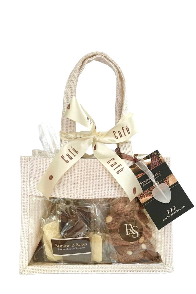 Coffee and chocolate gift bag. White clear fronted gift bag with handles, tied with a cream and brown ribbon, with Robins and Sons gift tag and white heart bag charm.