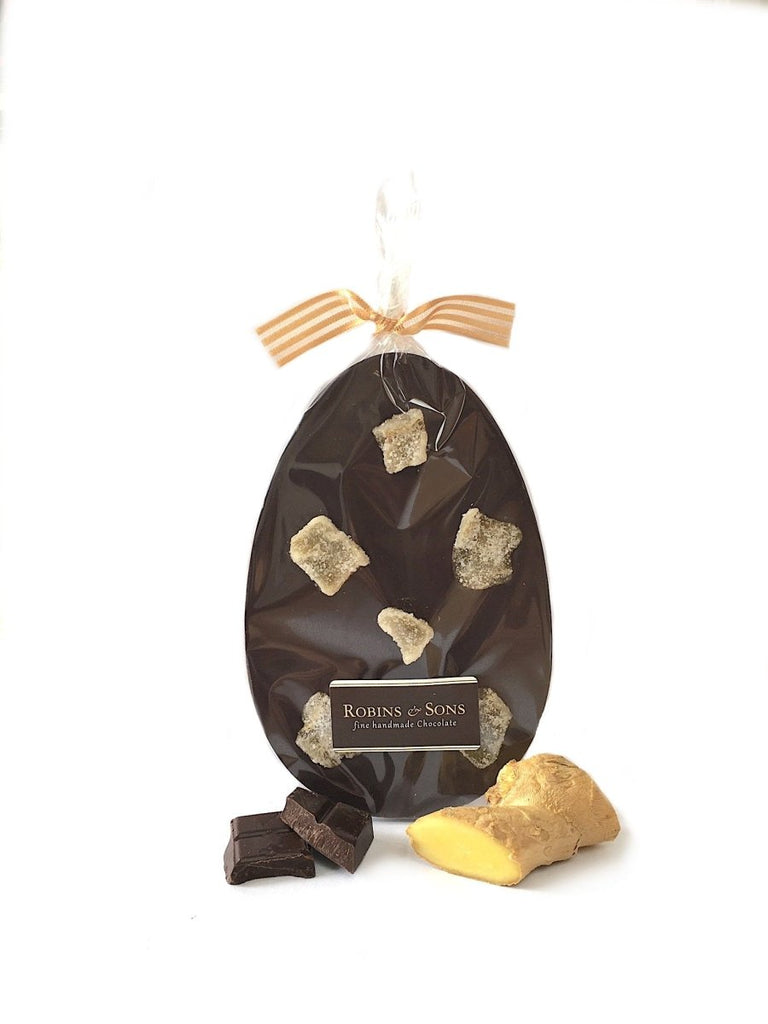 80% dark chocolate easter egg bar topped with crystallised ginger pieces in clear packaging topped with a gold bow