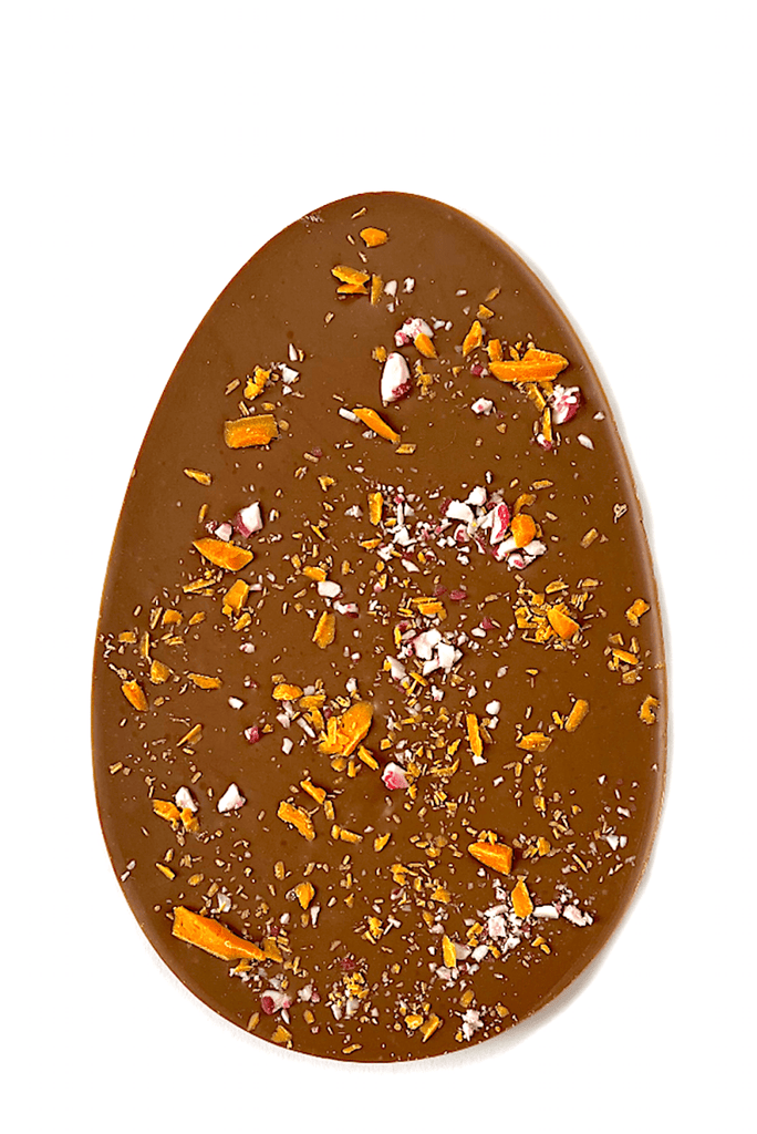 Orange Crackle Easter egg. Egg-shaped milk chocolate orange bar topped with Belgian orange chocolate shavings and fruit candy cane