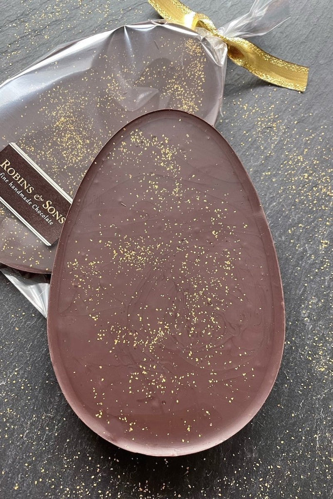 Purist Easter Egg bar. Egg-shaped slab of 80% dark chocolate dusted with edible gold glitter