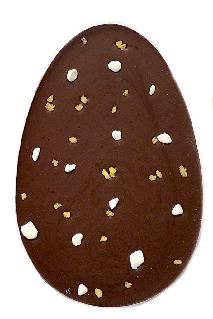 sicilian lemon easter egg. Oval shaped 70% dark chocolate flavoured with Sicilian lemon oil extract, lemon sugar crystals and meringue pieces