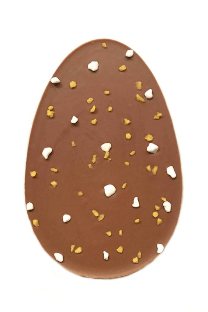 Sicilian Lemon Crunch Eater Egg. Milk chocolate egg-shaped bar flavoured with Sicilian lemon oil, topped with lemon sugar crystals and meringue pieces