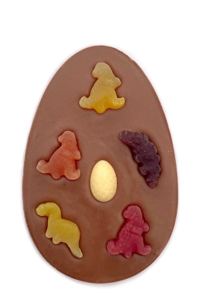 Dinosaur Easter Egg Bar. Egg shaped milk chocolate bar with 5 fruit flavour dinosaur shapes and white chocolate dinosaur egg