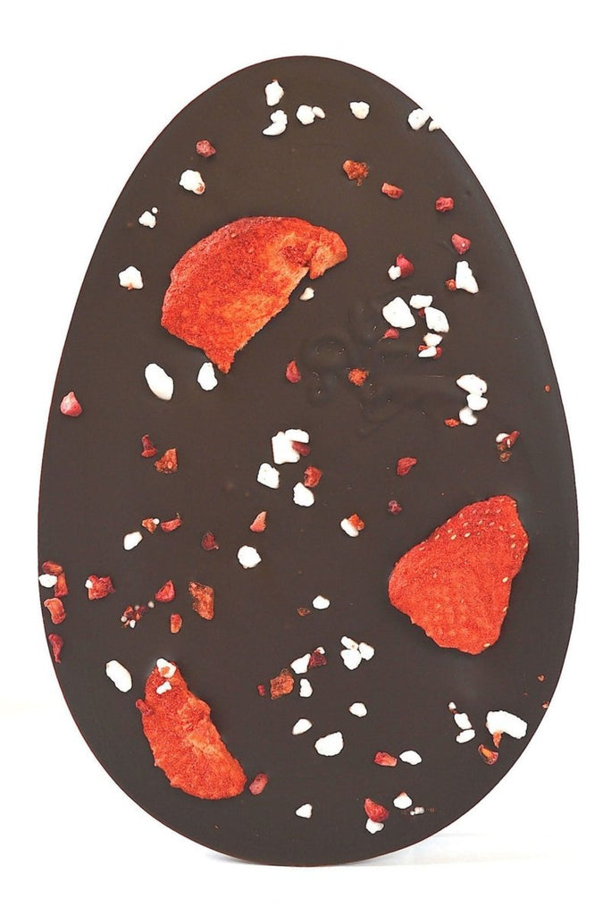 Dark chocolate egg shaped bar with strawberries, raspberries and meringue