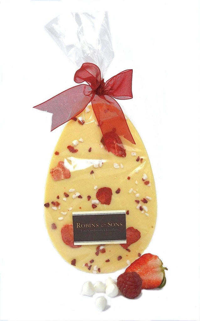 Easter chocolate gift bag. Very Berry Easter egg shaped bar topped with strawberries and meringue, in clear packaging tied with a red bow