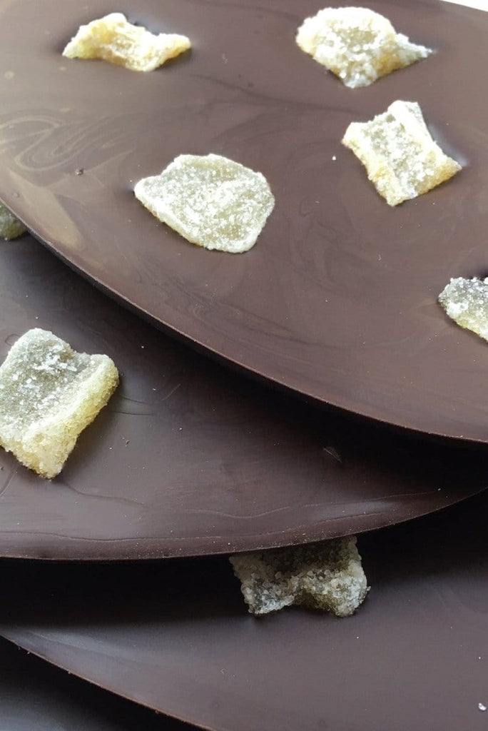 layered bars of dark chocolate with pieces of crystallised ginger